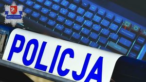 Klawiatura, galeryjka z napisem &quot;POLICJA&quot;, logo Komendy Powiatowej Policji w Lubaczowie.